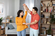 © Prostock-studio - Romantic asian couple enjoying time together at home, dancing
