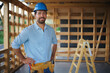 © Halfpoint - Portrait of construction worker smiling and looking at camera, diy eco-friendly homes concept.