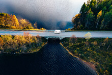Aerial View Caravan Trailer Or Camper Rv On The Bridge Over The Lake In Finland.