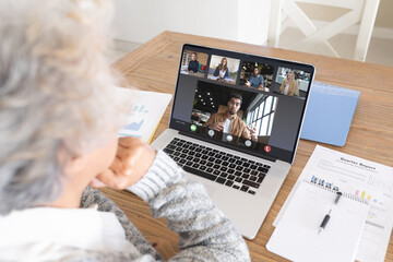 Poster - Composition of senior caucasian businesswoman having video call with colleagues