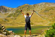 Hiker man in the Pyrenees- mountain and lake