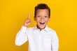 canvas print picture - Photo of overjoyed boy wear trendy clothes raise arm hand evrika brilliant excellent answer solution isolated on yellow color background