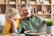 © Prostock-studio - Loving Middle Aged Couple Bonding Together While Relaxing With Laptop At Home