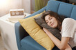 © StockPhotoPro - Relaxed woman sleeping on the sofa at home