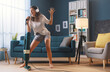 © StockPhotoPro - Woman cleaning up her house and singing