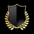 © totallyout - Black shield with golden laurel wreath on black background