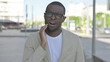 © stockbakers - Portrait of African Man having Toothache Outdoor