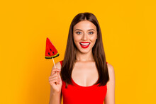 Photo Of Pretty Cheerful Girl Hold Watermelon Caramel Candy Toothy Smile Isolated On Yellow Color Background