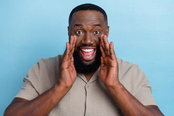 Sticker - Photo of overjoyed glad person arms near open mouth say tell information isolated on blue color background