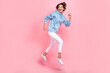 © deagreez - Full length photo of astonished pretty lady dressed blue sportswear run interesting look empty space isolated on pink color background