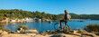 woman by bike- sea and typical spanish village