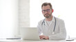 © stockbakers - Doctor Shaking Head as No Sign while using Laptop in Clinic