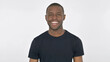 © stockbakers - Young African Man Smiling at Camera on White Background