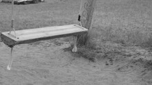 Old Wooden Swing In Sepia Toned. Deserted Swing In Children Playground. Missing Child Concept