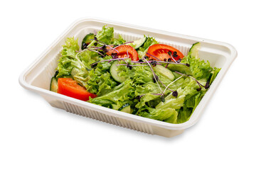Wall Mural - Salad with fresh vegetables and microgreens. In a plastic container. Food to go. On a light background.