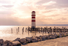 light house on pier in Podersdorf Austria next to Neusiedlersee at sunset