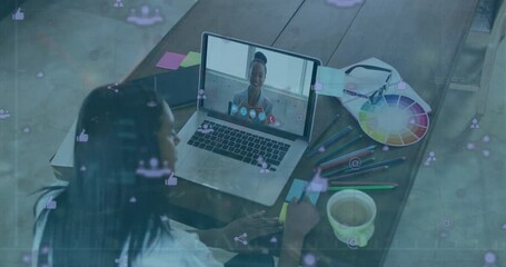 Poster - Animation of social media icons over african american businesswoman using laptop for video call