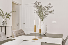 Table With Decorative Vase And Candles In Stylish Room