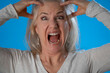 Close-up portrait of miserable desperate woman yelling claim bad mood isolated solid blue color background