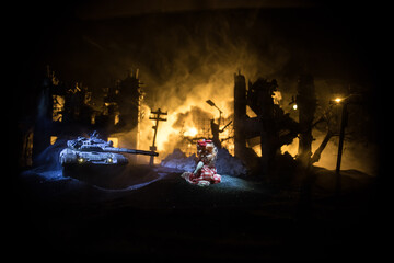 Wall Mural - Silhouette soldier carrying little boy on his shoulder from fire. Rescue savior concept. Man moving out with little boy from burned out city destroyed in war. Selective focus