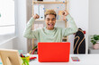 © Xavier Lorenzo - Excited young hispanic latin man celebrating good news using laptop at home. Euphoric winner happy student man using computer at desk in room