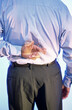 © SuperStock - Rear view of a businessman with his fingers crossed behind his back