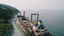 Aerial View Of Abandoned Cargo Ship. Bulk Carrier Ran Aground After The Storm. Dry Cargo Ship RIO Stands Ashore.