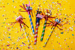 © SuperStock - Party horn blowers and confetti