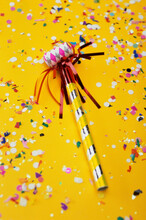Close-up Of A Party Horn Blower And Confetti