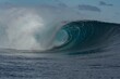 Beautiful shot of a huge blue wave in the ocean in Teahupoo village