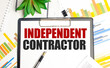 Independent Contractor words on paper tablet and charts