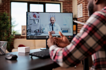 Poster - Young man talking to doctor on videocall telemedicine conference on internet connection. Meeting with medic on telehealth videoconference online on computer, chatting o remote teleconference.