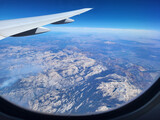 Fototapeta  - Aircraft flying over the landscape flight above the Rocky Mountains near Denver