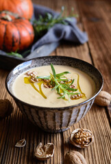 Canvas Print - Creamy pumpkin and walnut soup in a bowl