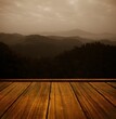 Wooden floor against mountains