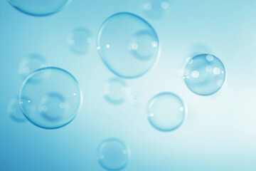 Wall Mural - Abstract Beautiful Transparent Blue Soap Bubbles Background. Soap Sud Bubbles Water.	
