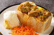 traditional durban mutton bunny chow closeup on plate on the table. Horizontal