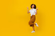 Leinwandbild Motiv Full length photo of excited charming person hands fingers show v-sign empty space isolated on yellow color background