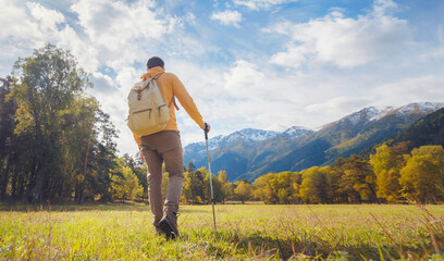 Wall Mural - trip to Caucasus mountains, Arkhyz, Teberdinsky reserve. concept of discovery and exploration of wild places in early autumn. Man hiking in mountains with backpack and photo camera