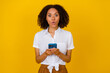 © deagreez - Photo of impressed nice person hold telephone pouted lips unexpected isolated on yellow color background