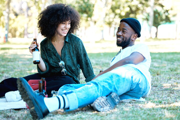 Sticker - Interracial couple in nature park together, man and woman relax with drink on grass and happiness for people on picnic date outside. Happy black friends dating, laughing and having fun on weekend