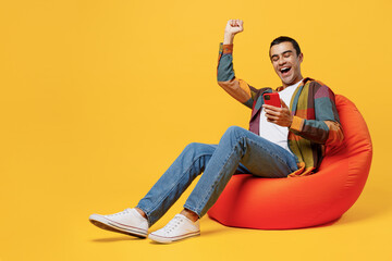 full body young overjoyed happy fun middle eastern man he wearing casual shirt white t-shirt sit in 