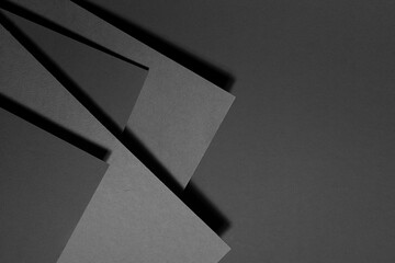 Poster - dark grey carbon textured abstract geometric background with soar stepped rectangle surfaces with an