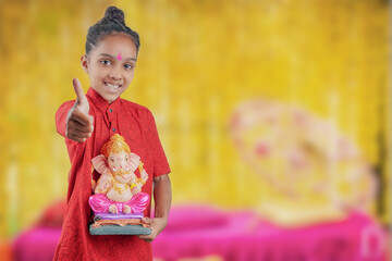 Little Indian child with lord ganesha