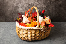 Bottle Of Red Wine With Apples And Cookies In A Gift Basket. Hamper For Autumn Thanksgiving Festival