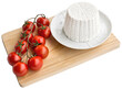 Light wood cutting board with cow's milk ricotta on top with a bunch of cherry tomatoes. isolated