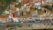 © Jesús Francés/Wirestock Creators - Aerial view of Porto Ribeira's colorful buildings and waterside street