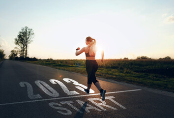 Fototapete - Sports girl who wants to start the new year 2023. Concept of new professional achievements in the new year and success. New Year 2023 with new ambitions, challenge, plans, goals and visions. 