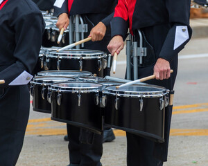 Wall Mural - snare section of a marching band drum line warming up for a parade