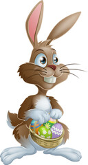 Wall Mural - Easter bunny rabbit holding Easter eggs basket